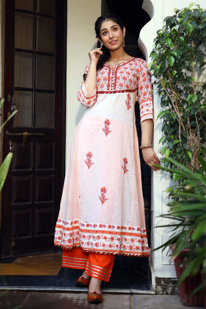 Kalidaar Kurta in orange color with cream base