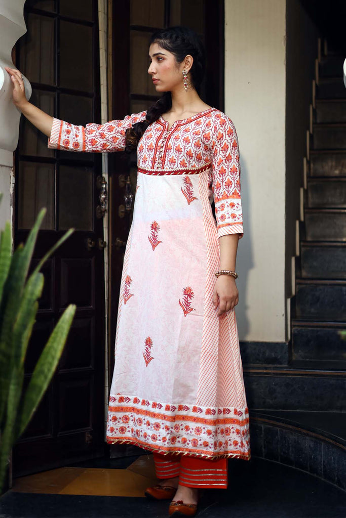 Kalidaar Kurta in orange color with cream base