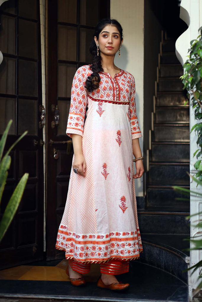 Kalidaar Kurta in orange color with cream base