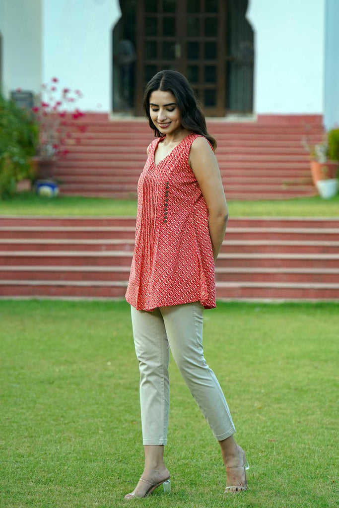 Sleeveless Short Length Kurti In Brick Red Color